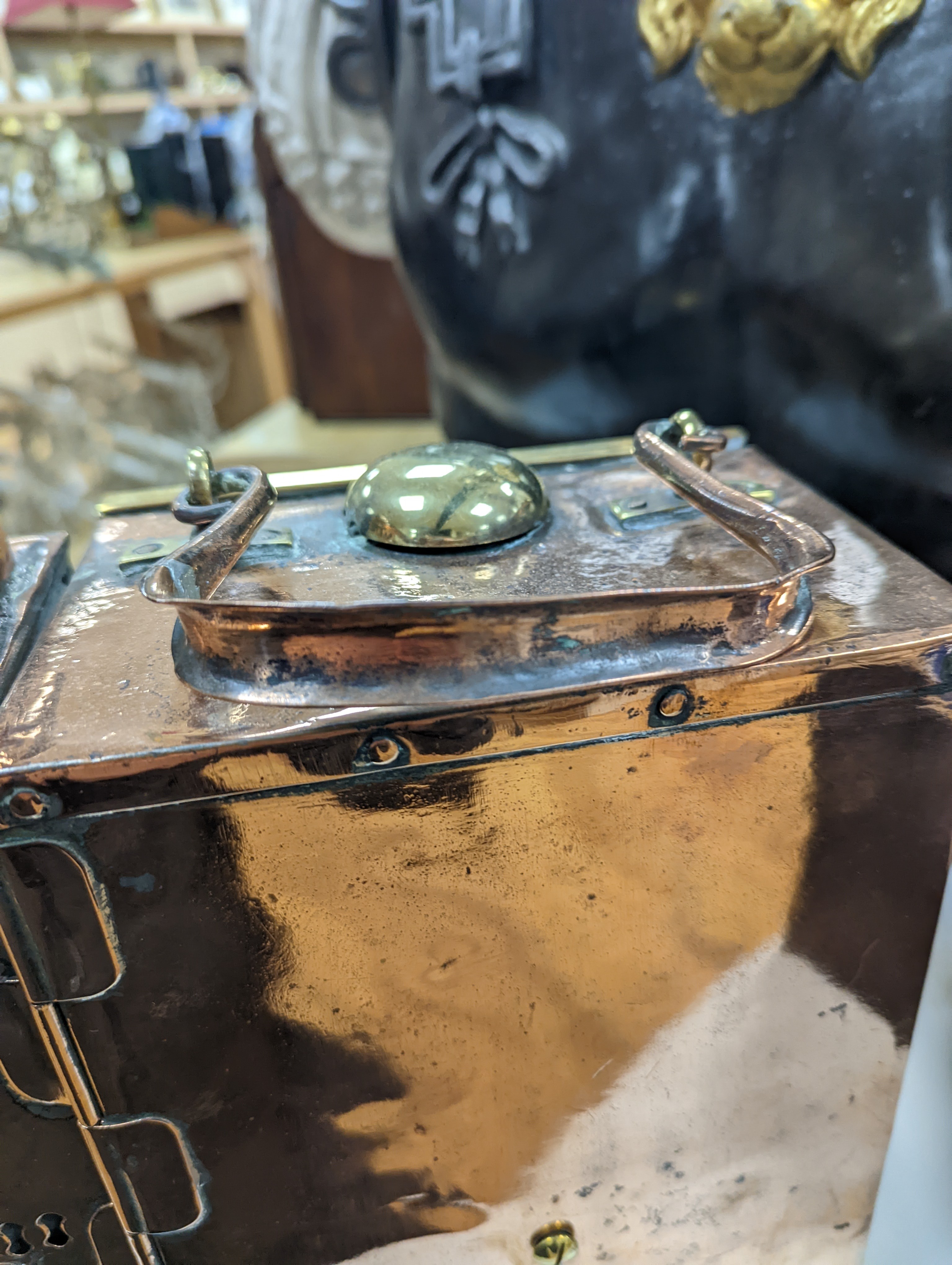 A copper ship's binnacle compass, a brass oil lamp, a brass jug and a copper kettle
